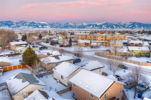 snowy aerial view with a mountain view