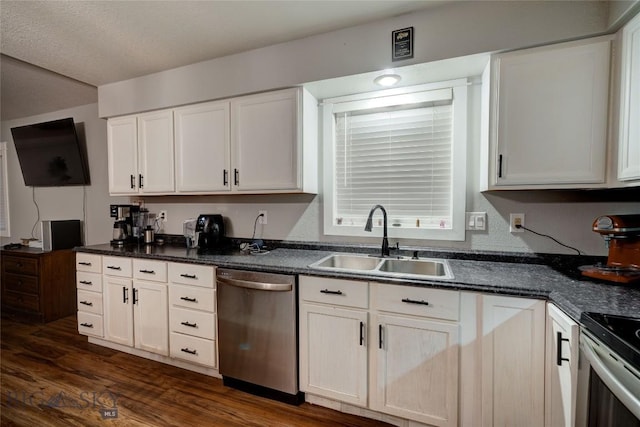 kitchen with stainless steel appliances, sink, and white cabinets