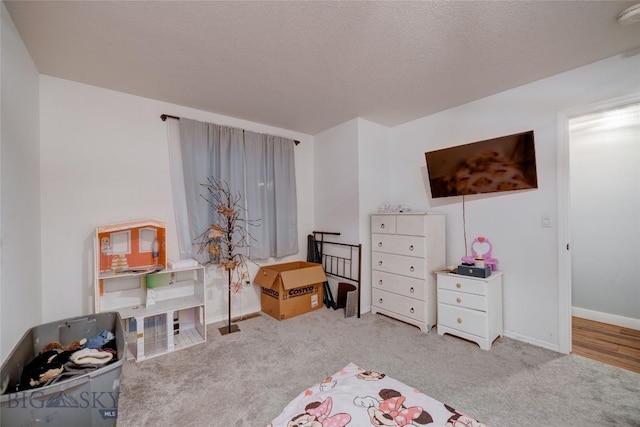 carpeted bedroom with a textured ceiling