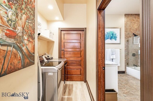 laundry room featuring washing machine and clothes dryer