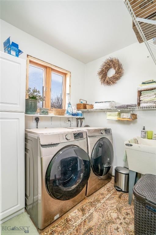 laundry area with sink and washing machine and dryer