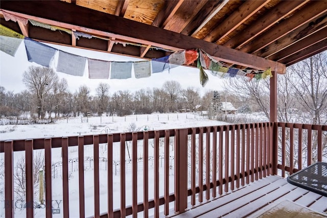 view of snow covered deck