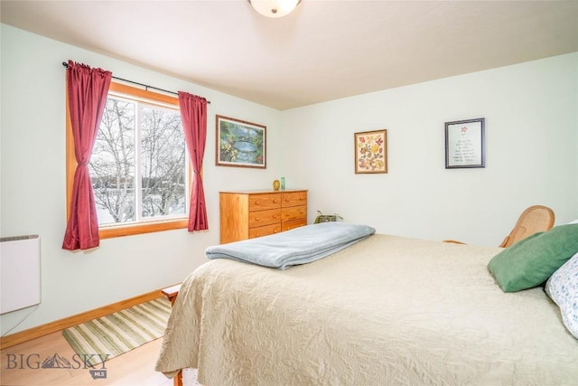 bedroom featuring wood-type flooring