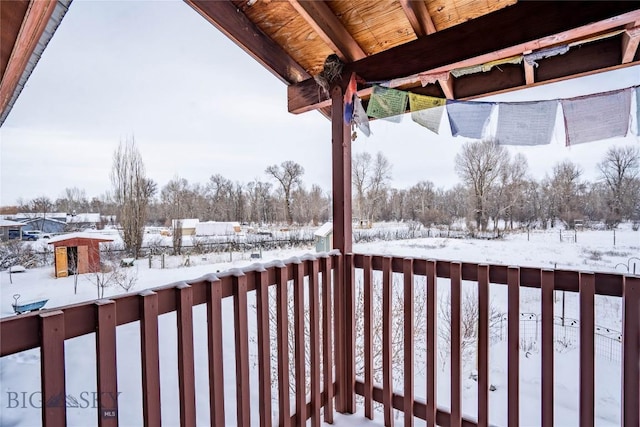 view of snow covered deck