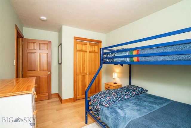 bedroom with a closet and light wood-type flooring