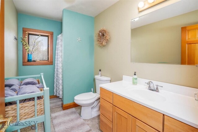 2225 Stagecoach Trail Rd, Manhattan, MT 59741 - bathroom featuring toilet, vanity, and curtained shower