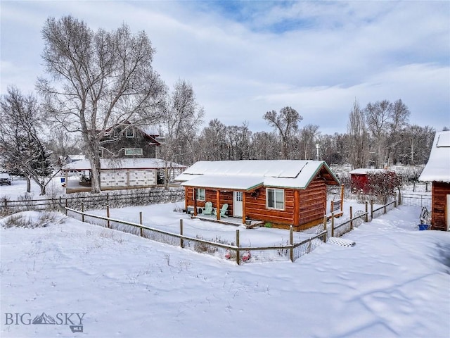 view of snow covered house