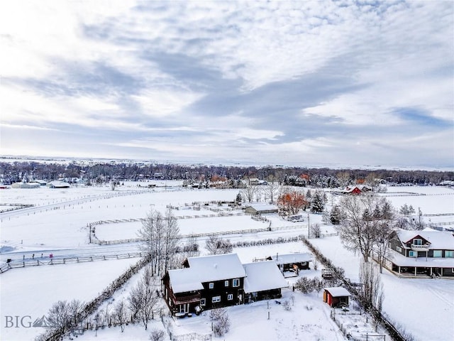 snowy aerial view with a rural view