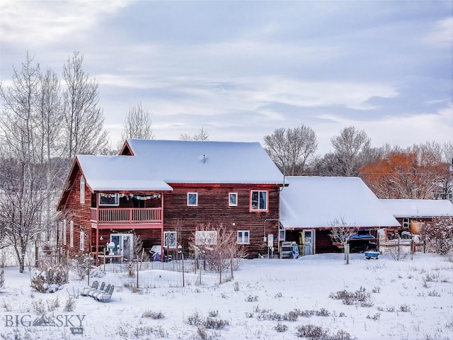 2225 Stagecoach Trail Rd, Manhattan, MT 59741 - snow covered house with a balcony