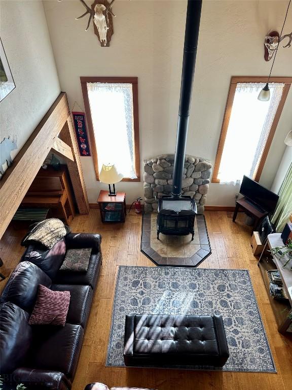 2225 Stagecoach Trail Rd, Manhattan, MT 59741 - living room with a wood stove and hardwood / wood-style floors