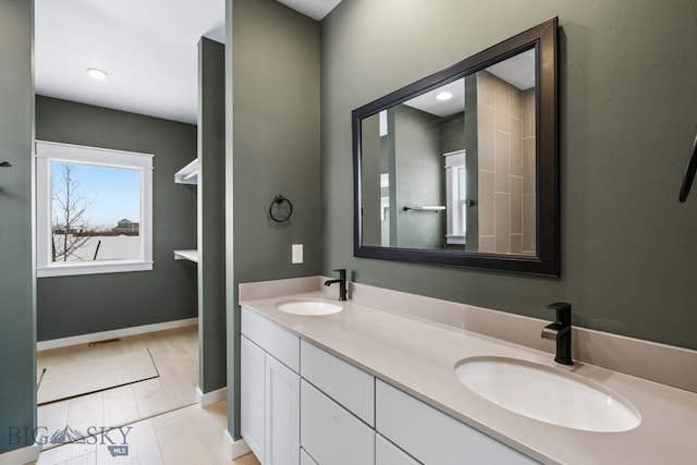 bathroom with vanity and hardwood / wood-style flooring