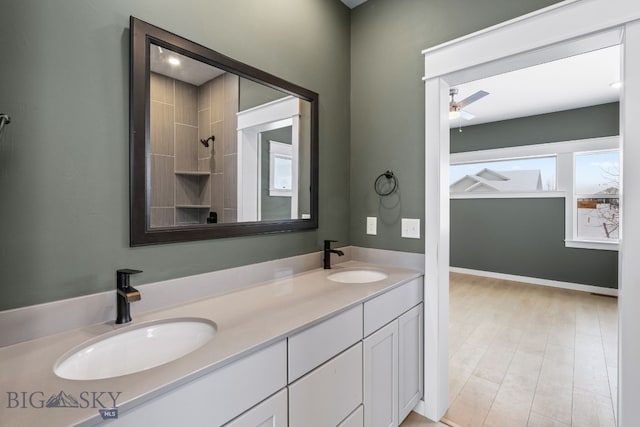 bathroom featuring ceiling fan and vanity