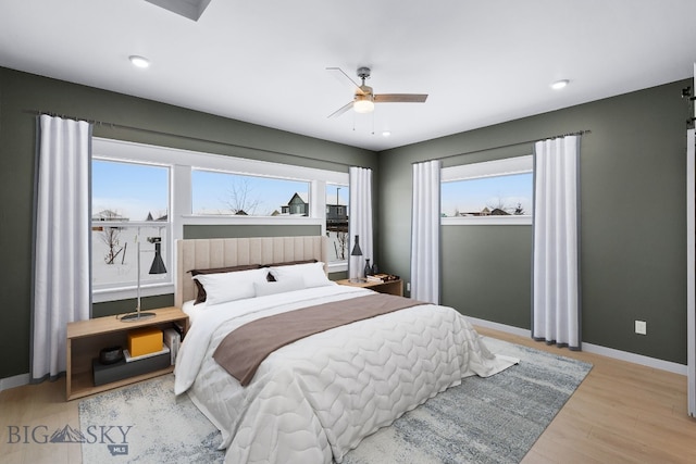 bedroom featuring ceiling fan and light wood-type flooring