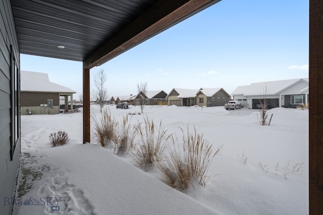 view of yard covered in snow