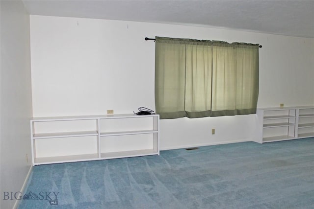 spare room featuring carpet flooring