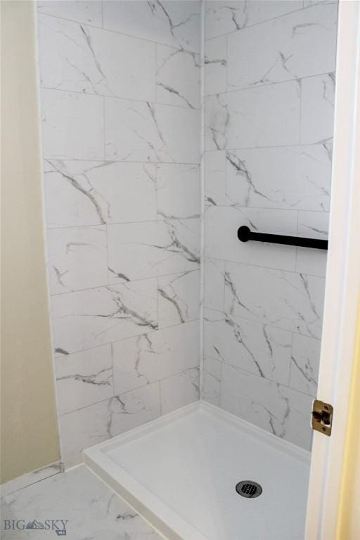 full bath with a shower stall