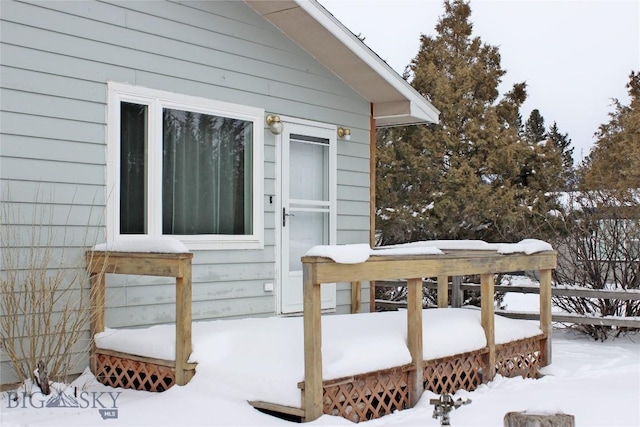 view of snow covered deck