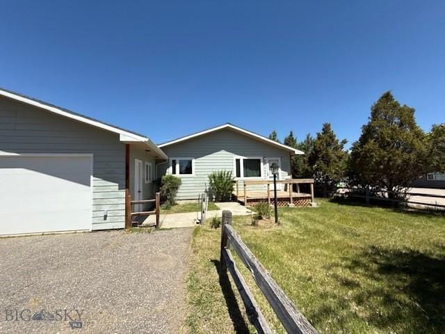 218 W Armitage St, Ennis, MT 59729 - view of front of home with a wooden deck