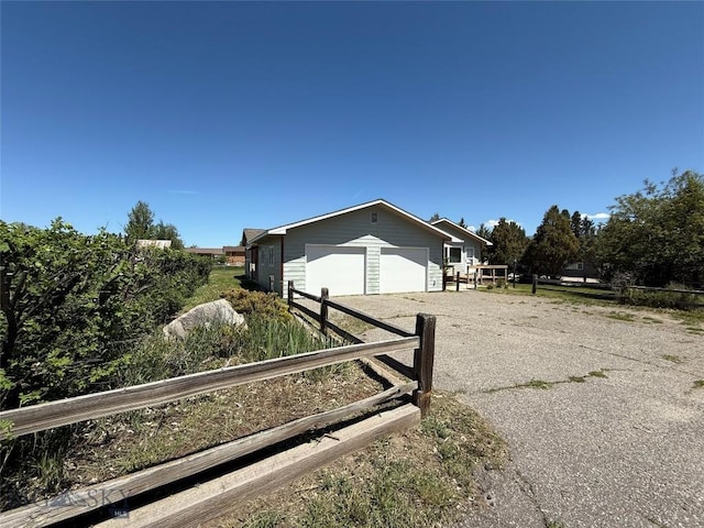 218 W Armitage St, Ennis, MT 59729 - view of front of house with driveway and a garage