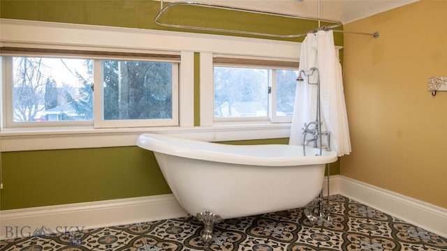 bathroom with tile patterned flooring and independent shower and bath