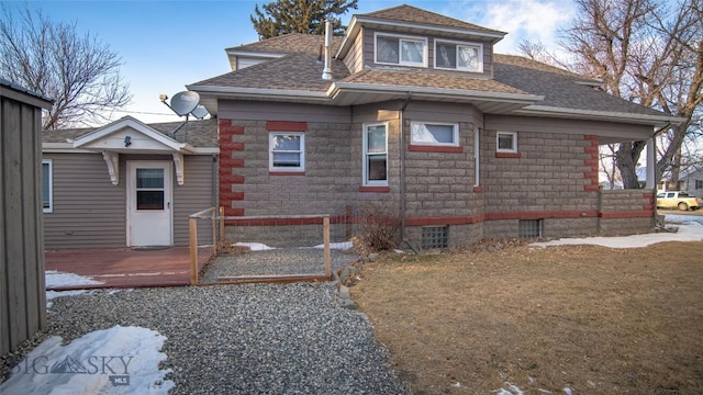 view of property exterior featuring a yard and a deck