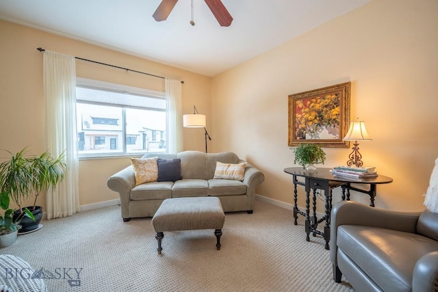 living room with light colored carpet and ceiling fan