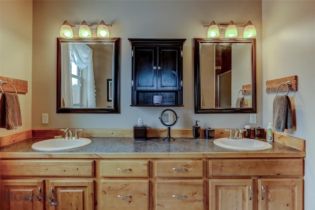 full bath with a sink and double vanity