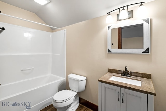 full bathroom featuring toilet, bathing tub / shower combination, wood-type flooring, vaulted ceiling, and vanity