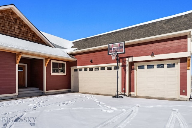 view of snow covered garage