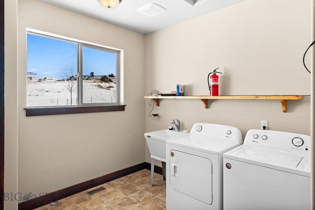 laundry area with separate washer and dryer