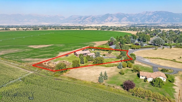 birds eye view of property featuring a mountain view and a rural view