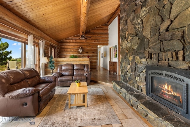 living room featuring beam ceiling, wood ceiling, a stone fireplace, and high vaulted ceiling