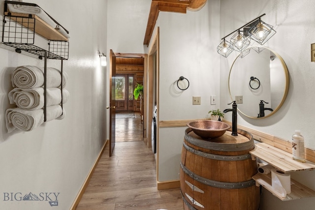 bathroom featuring wood-type flooring and vanity