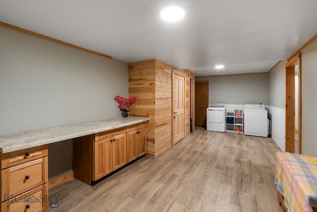 washroom featuring independent washer and dryer and light wood-type flooring