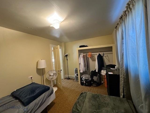 bedroom with light colored carpet and a closet