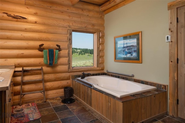 75 Madison Trl, Cameron, MT 59720 - bathroom with vanity, log walls, and a bathing tub