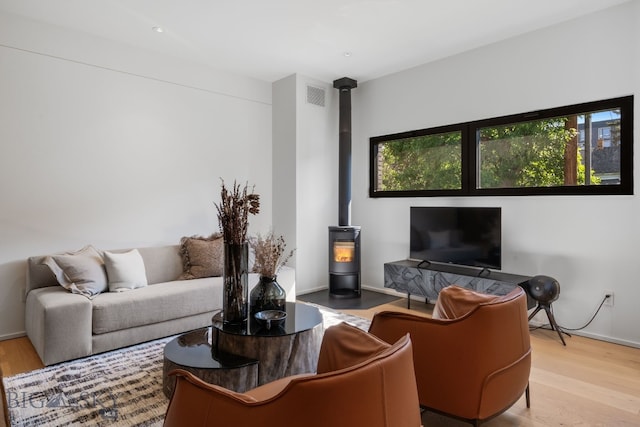 217 W Beall St Unit B, Bozeman, MT 59715 - living area with a wood stove and wood finished floors