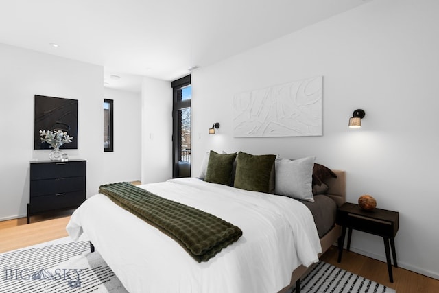 217 W Beall St Unit B, Bozeman, MT 59715 - bedroom featuring light wood-style floors and baseboards