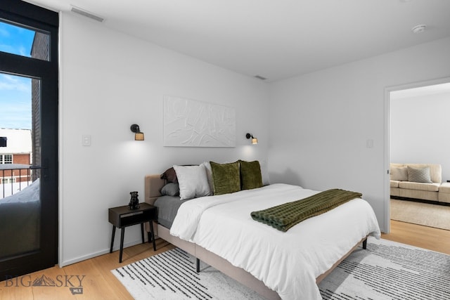 217 W Beall St Unit B, Bozeman, MT 59715 - bedroom featuring multiple windows and light wood finished floors
