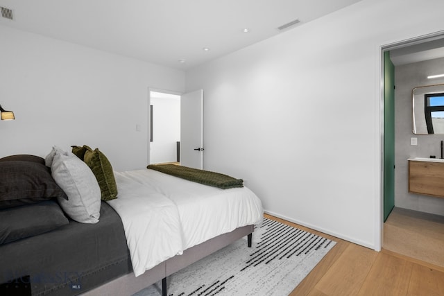 217 W Beall St Unit B, Bozeman, MT 59715 - bedroom featuring light wood-style flooring and recessed lighting