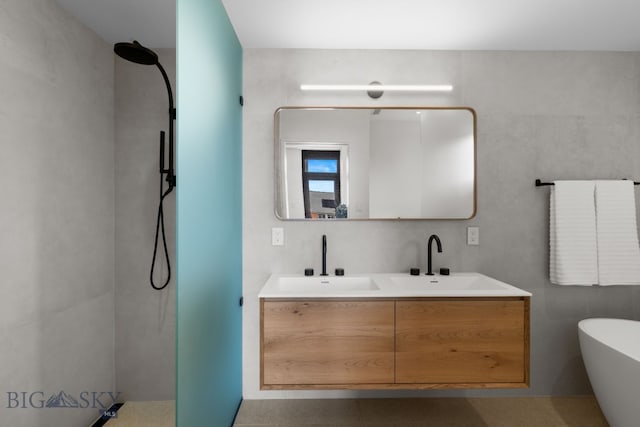 217 W Beall St Unit B, Bozeman, MT 59715 - bathroom featuring tiled shower, double vanity, and a freestanding bath