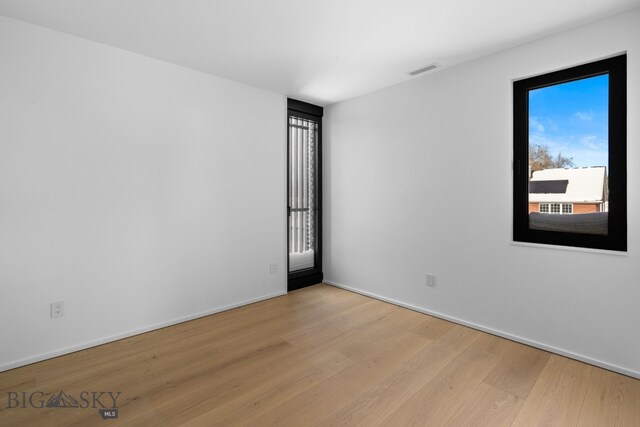 217 W Beall St Unit B, Bozeman, MT 59715 - empty room featuring light wood-style flooring and baseboards