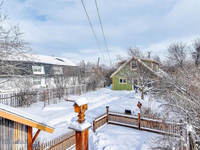 snowy yard with an outdoor structure