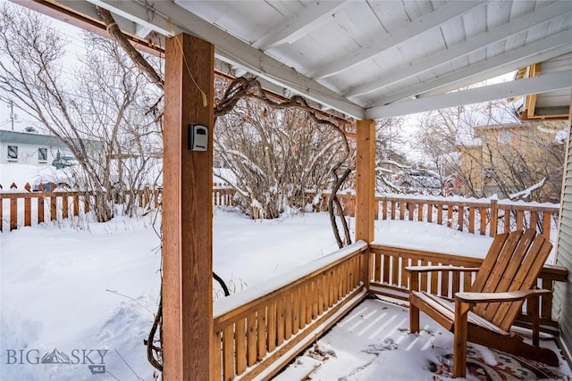 view of snow covered deck