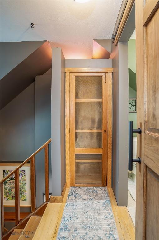 corridor featuring light hardwood / wood-style floors