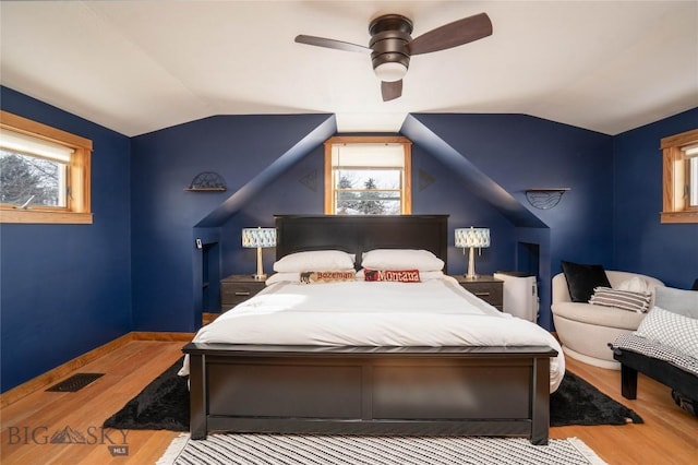 bedroom featuring vaulted ceiling, ceiling fan, and hardwood / wood-style floors