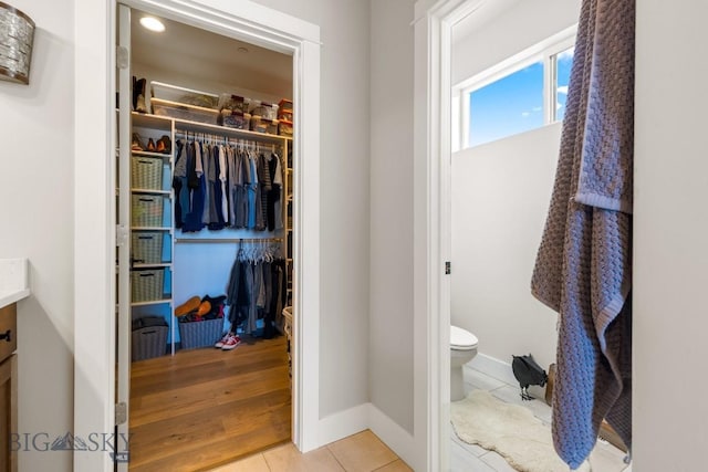 bathroom with tile patterned floors, toilet, and vanity