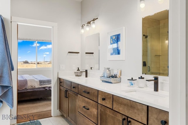 bathroom with tile patterned flooring, vanity, and a shower with shower door