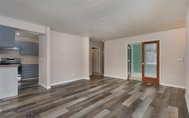 unfurnished living room with dark hardwood / wood-style floors