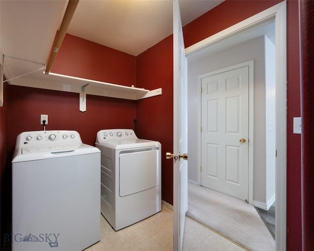 washroom with washer and dryer